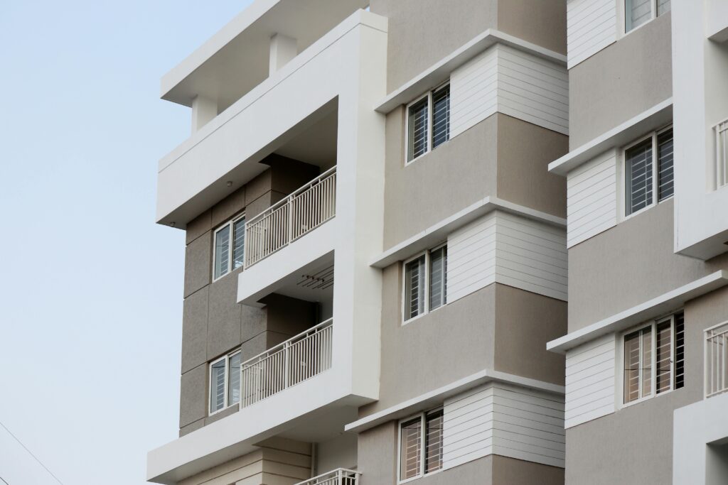 A close-up of a modern apartment building facade in Hyderabad, India.